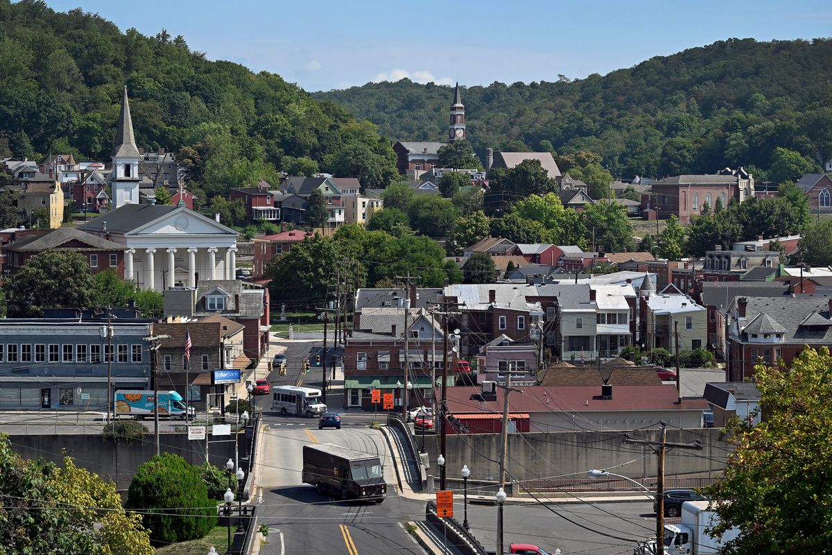 The view of from the hill area above the city of Cumberland, Maryland on Aug 29. Cumberland has had a a bit of a growth bump, and to keep the momentum going, the city launched a pilot program to offer up to $20,000 to 10 families who relocate and commit to staying for at least five years.  (Washington Post)