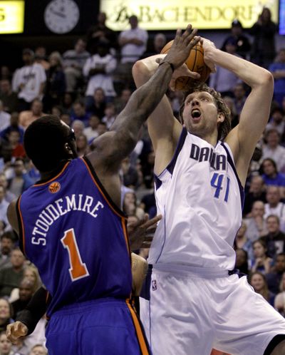 Mavericks’ Dirk Nowitzki, right, led Dallas past the San Antonio Spurs on Saturday night with 27 points. (Associated Press)