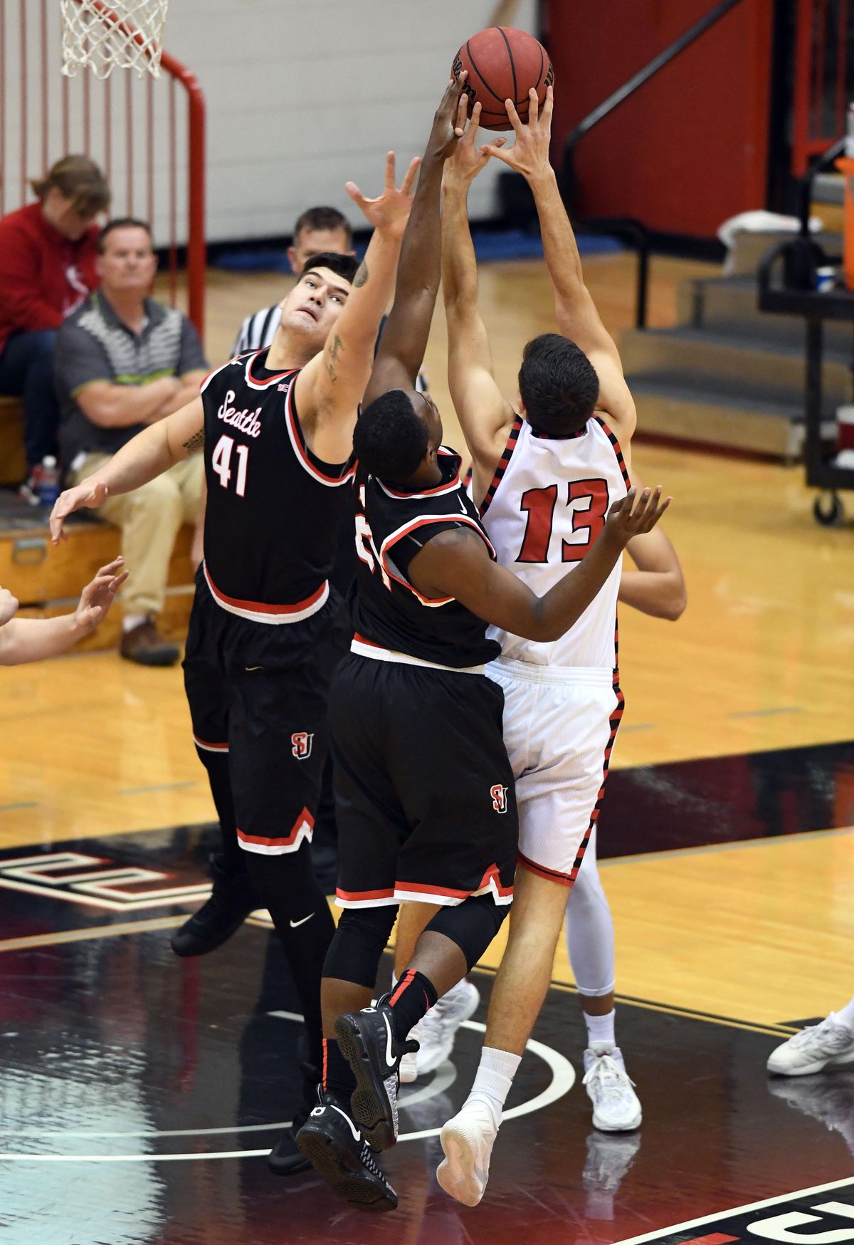 Eastern Washington guard Luka Vulikic (13) reaches for a rebound during the first half of a men