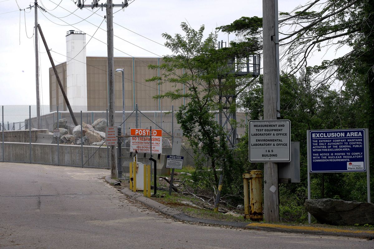 Warning signs are posted near a gate to the Pilgrim Nuclear Power Station in Plymouth, Mass., on May 28, 2019. The plant featured a boiling water reactor and provided power to the region for nearly half a century.  (Steven Senne)