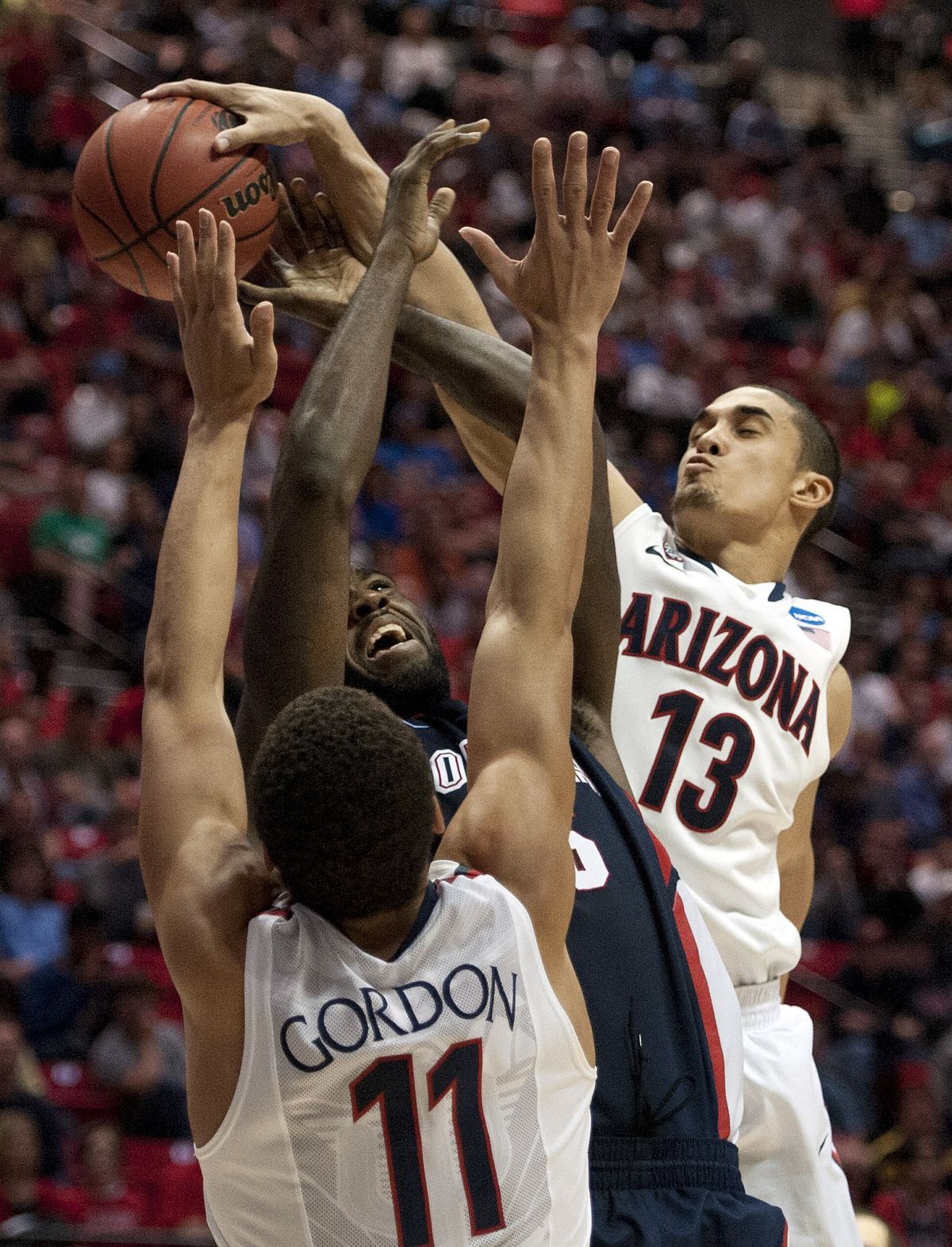 Arizona’s Aaron Gordon and Nick Johnson contest a shot by Sam Dower Jr., who scored just seven points. (Dan Pelle)