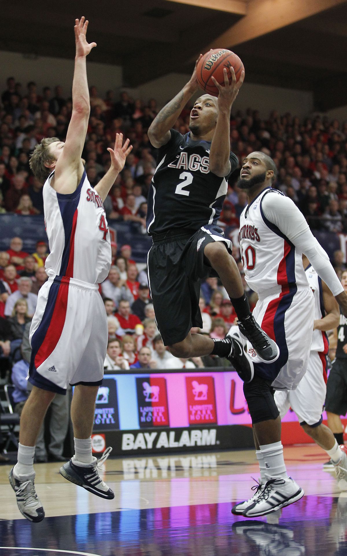 Gonzaga guard Marquise Carter (2) drives to the basket between St. Mary