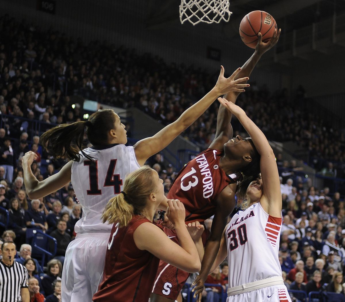 Gonzaga’s Sunny Greinacher, left, and Stephanie Golden battle Stanford’s Chiney Ogwumike (13) for a rebound. (Colin Mulvany)