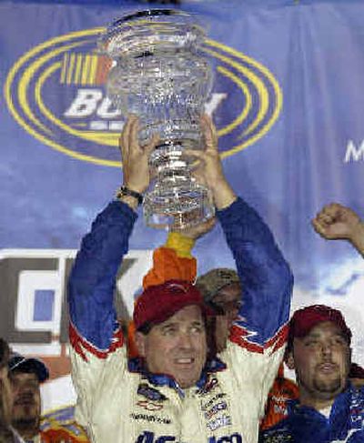 Ron Hornaday Jr. holds up the trophy after winning the NASCAR Busch Series' Alan Kulwicki 250.
(Associated Press / The Spokesman-Review)