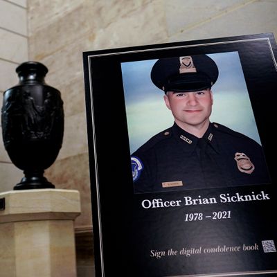 A sign outside the Rotunda memorializes U.S. Capitol Police Officer Brian D. Sicknick.    (Salwan Georges/The Washington Post)