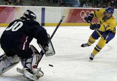 
Sweden's Maria Rooth unleashes the game-winning shot against U.S. goalie Chanda Gunn on Friday.
 (Associated Press / The Spokesman-Review)