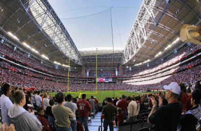
Fans watch the Arizona Cardinals and Cleveland Browns from the south end zone at University of Phoenix Stadium in Glendale, Ariz., where the Super Bowl will be played Feb. 3.Associated Press photos
 (Associated Press photos / The Spokesman-Review)