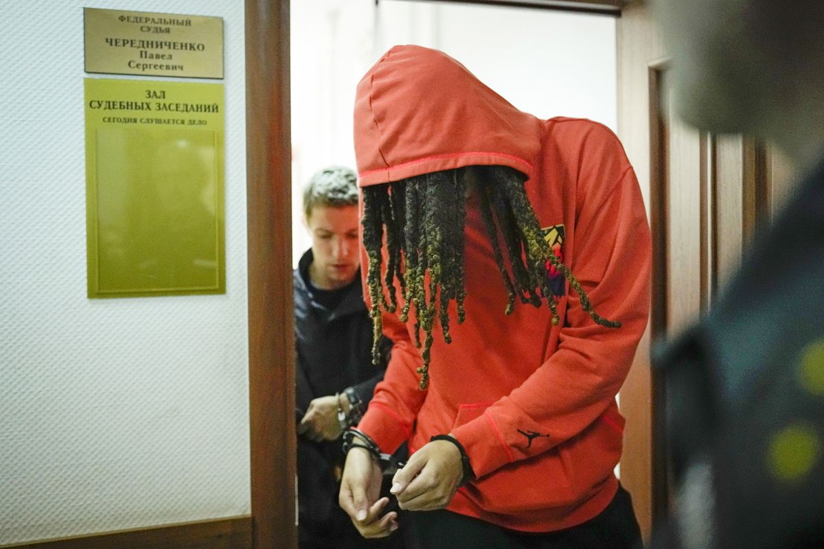 WNBA star and two-time Olympic gold medalist Brittney Griner leaves a courtroom after a hearing, in Khimki just outside Moscow, Russia, Friday, May 13, 2022. Griner, a two-time Olympic gold medalist, was detained at the Moscow airport in February after vape cartridges containing oil derived from cannabis were allegedly found in her luggage, which could carry a maximum penalty of 10 years in prison.  (Alexander Zemlianichenko)