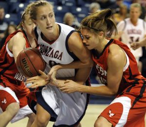 After a loose ball, Gonzaga's Heather Bowman and EWU's Julie Piper the try to gain control of the ball in the first half at McCarthey Athletic Center Tuesday Dec. 1, 2009. (Colin Mulvany / The Spokesman-Review)