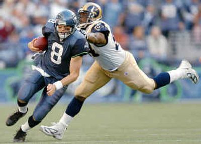 
Hawks quarterback Matt Hasselbeck has faced tribulation since the St. Louis game three weeks ago. 
 (Associated Press / The Spokesman-Review)