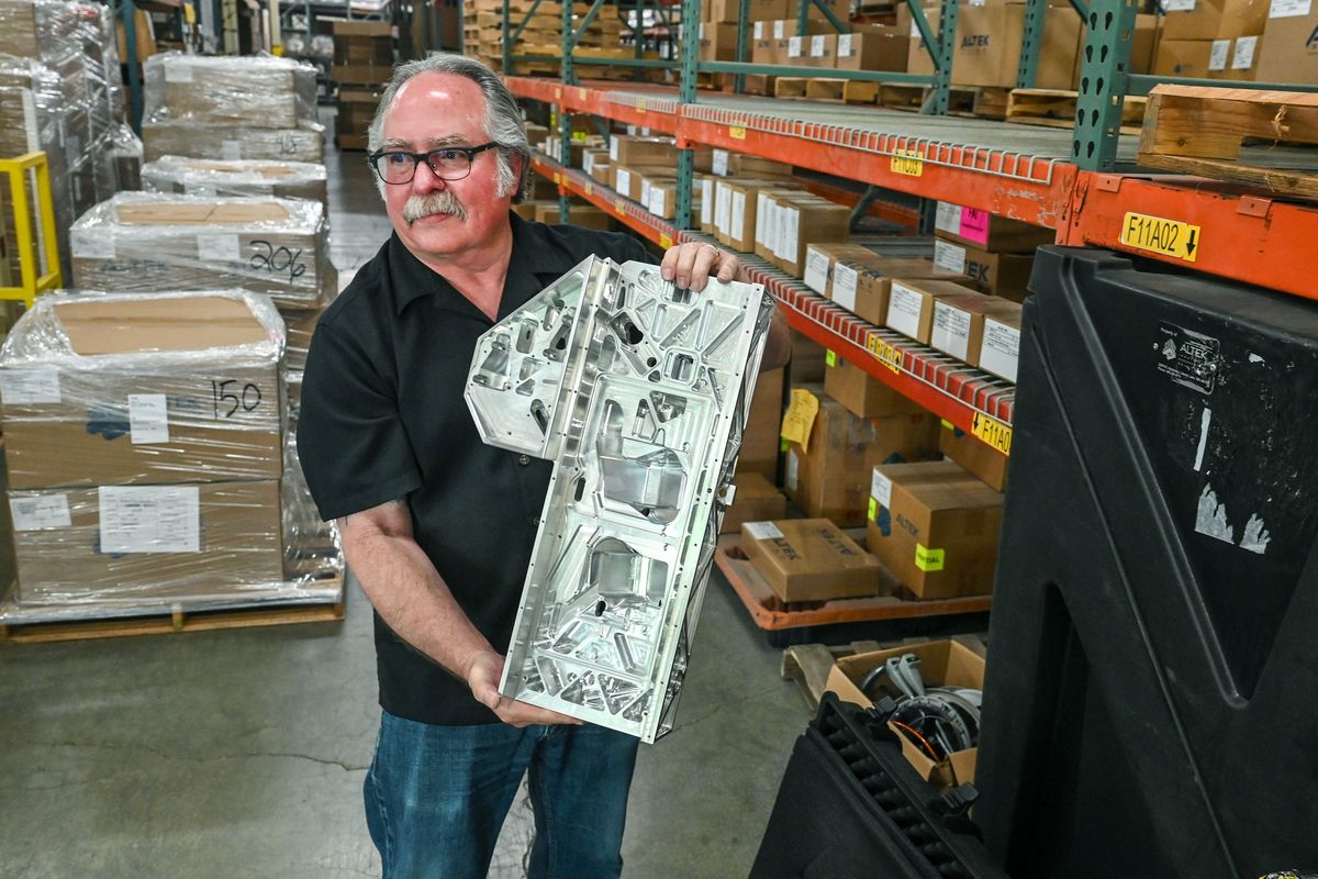 Rick Taylor, vice president at Altek Inc., holds a piece of a military equipment part his company produced in Liberty Lake. It will be on display this week at the I-90 Aerospace Corridor Conference & Expo at the Coeur d’Alene Resort.  (DAN PELLE/THE SPOKESMAN-REVIEW)