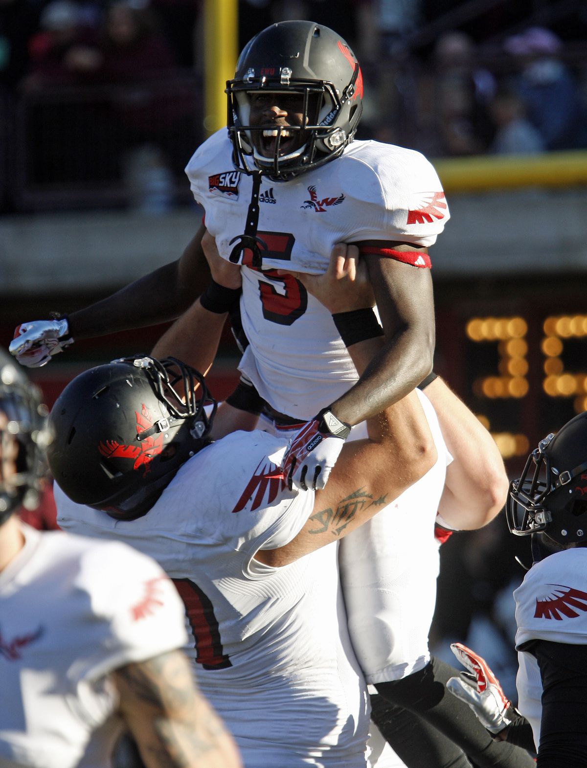 EWU running back Mario Brown is held aloft after hauling in a third-quarter pass for a touchdown in Missoula. (Associated Press)