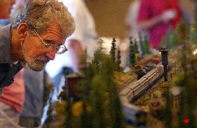 Steve Zink leans in for a look at the Salmon Arm (B.C.) Model Railroad Association's display at Sunday's show in Spokane Valley.
(Liz Kishimoto / The Spokesman-Review)