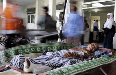 
An elderly man injured in Saturday's earthquake lies outside a hospital Wednesday in Yogyakarta, Indonesia. More than 6,200 people were killed by the quake.
 (Associated Press / The Spokesman-Review)