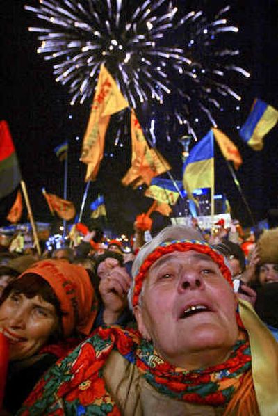 
Ukrainians celebrate the vote on electoral reforms during a rally Wednesday in Kiev. 
 (Associated Press / The Spokesman-Review)