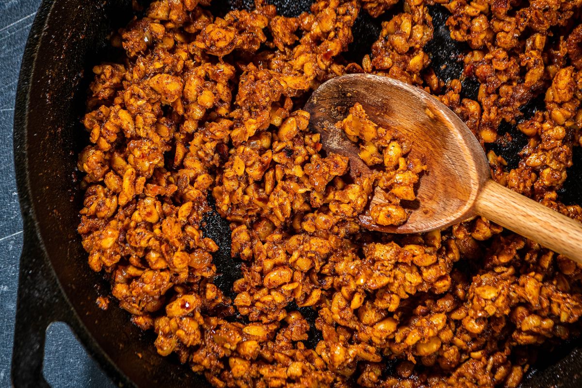 Crumbled tempeh being cooked for tacos.  (Rey Lopez/For The Washington Post)