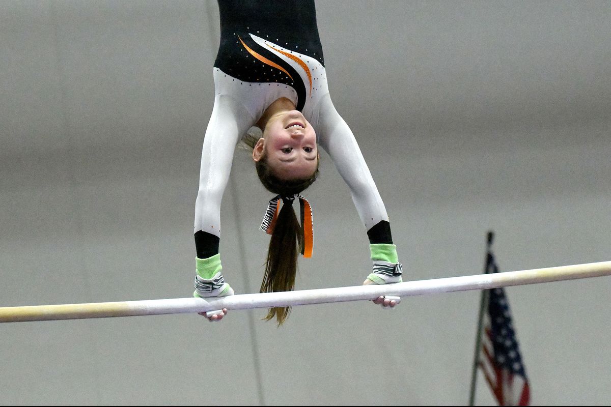 Lewis and Clark’s Lyra Mylroie competes on the uneven bars during Wednesday’s GSL gymnastics championships at Mead Gymnastics Center.  (Kathy Plonka/The Spokesman-Review)