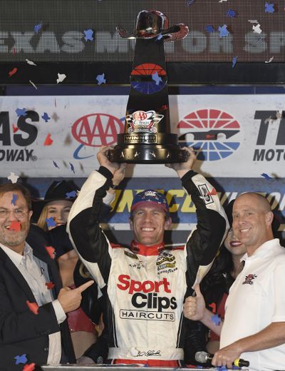 Carl Edwards, center, celebrates in victory lane after winning at Texas Motor Speedway. (Larry Papke / AP)