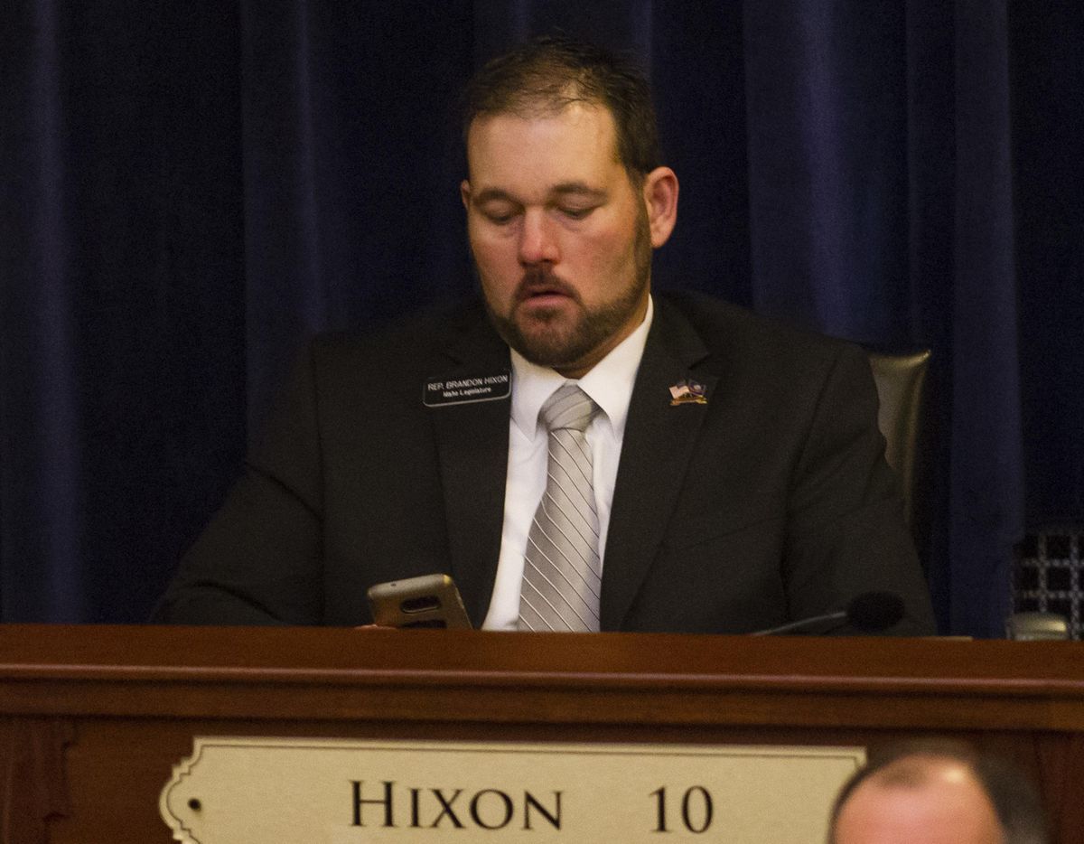 FILE – In this Jan. 9, 2017 file photo, then Idaho Rep. Brandon Hixon, R-Caldwell, waits before the State of the State address inside the house chambers at the state Capitol building in Boise, Idaho. Hixon committed suicide, it was announced by House Speaker Scott Bedke on Jan. 9, 2018. (Otto Kitsinger / AP)