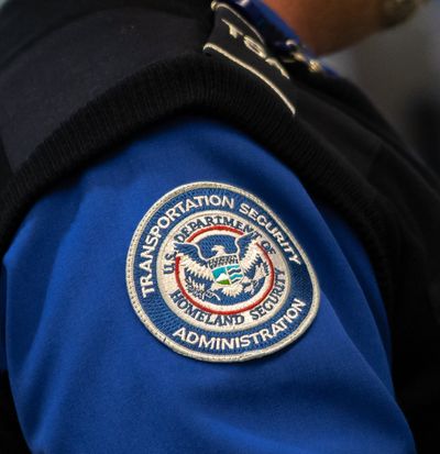 A Transportation Security Administration officer scans passangers at Spokane International Airport on Jan. 21, 2019.  (Libby Kamrowski)