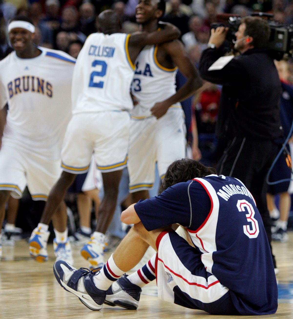 Gonzaga star Adam Morrison, who scored 24 points, is overcome by the agony of defeat after 2006 loss to UCLA in Sweet 16. (Associated Press)