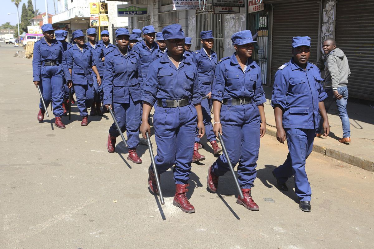 Zimbabwe police are seen on the streets of Harare, Zimbabwe, on Thursday, Aug, 2, 2018. Zimbabwe’s acting President Emmerson Mnangagwa said Thursday that his government had been in touch with the main opposition leader in an attempt to ease tensions after election related violence in the capital. (Tsvangirayi Mukwazhi / AP)