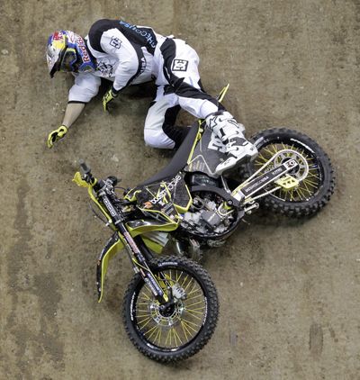 Travis Pastrana crashes while competing in the Moto X best trick event at the 2011 X Games. (Associated Press)