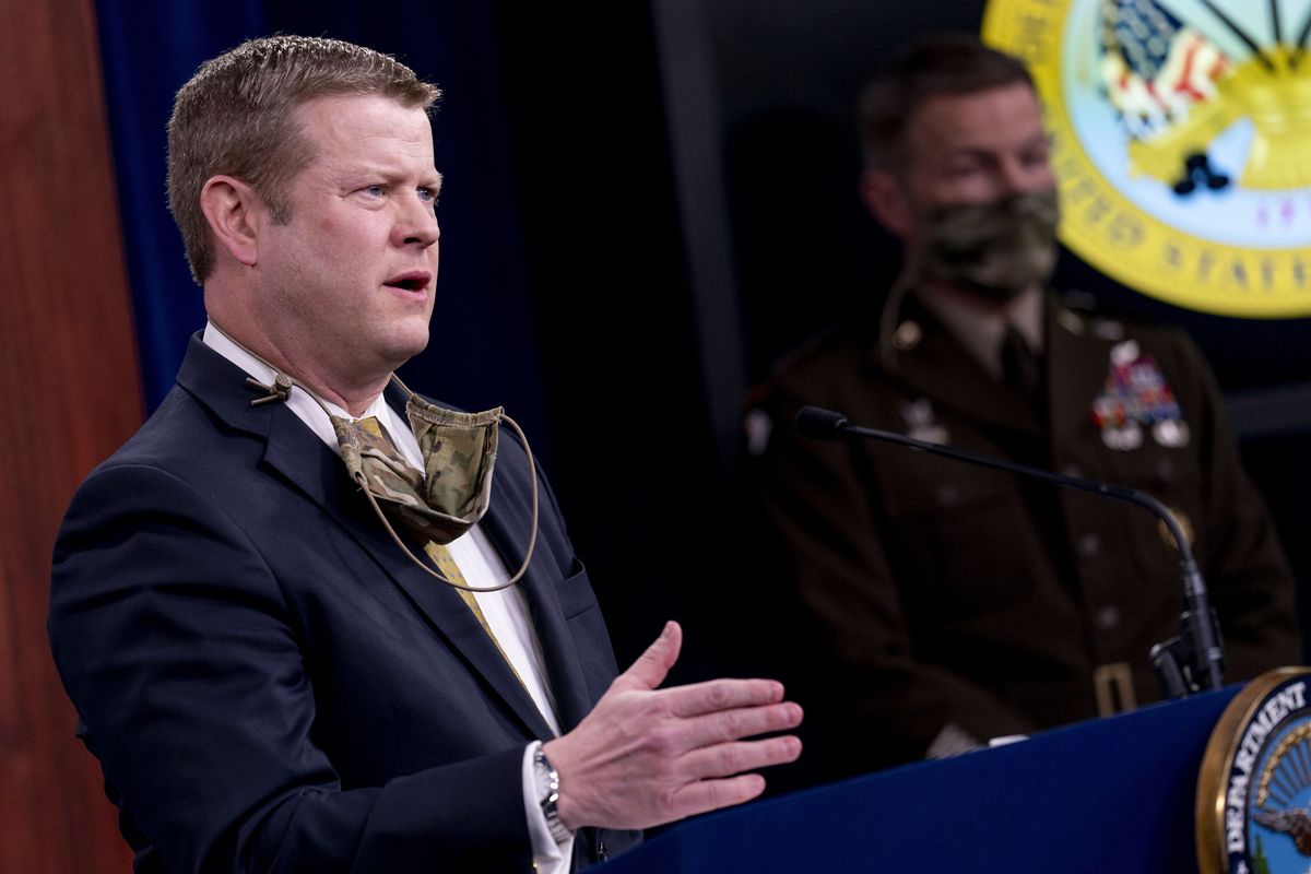 Secretary of the Army Ryan McCarthy, left, accompanied by Gen. James McConville, Chief of Staff of the Army, right, speaks during a briefing on an investigation into Fort Hood, Texas at the Pentagon, Tuesday, Dec. 8, 2020, in Washington. The Army says it has fired or suspended 14 officers and enlisted soldiers at Fort Hood, Texas, and ordered policy changes to address chronic leadership failures at the base that contributed to a widespread pattern of violence including murder, sexual assaults and harassment.  (Andrew Harnik)