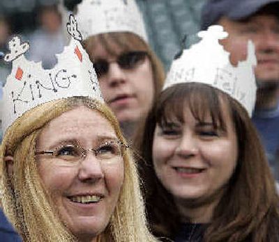 M's fans Barb McGee, left, Shelly Johnson, right, and Julie Day, all of Spokane, wear crowns in honor of  