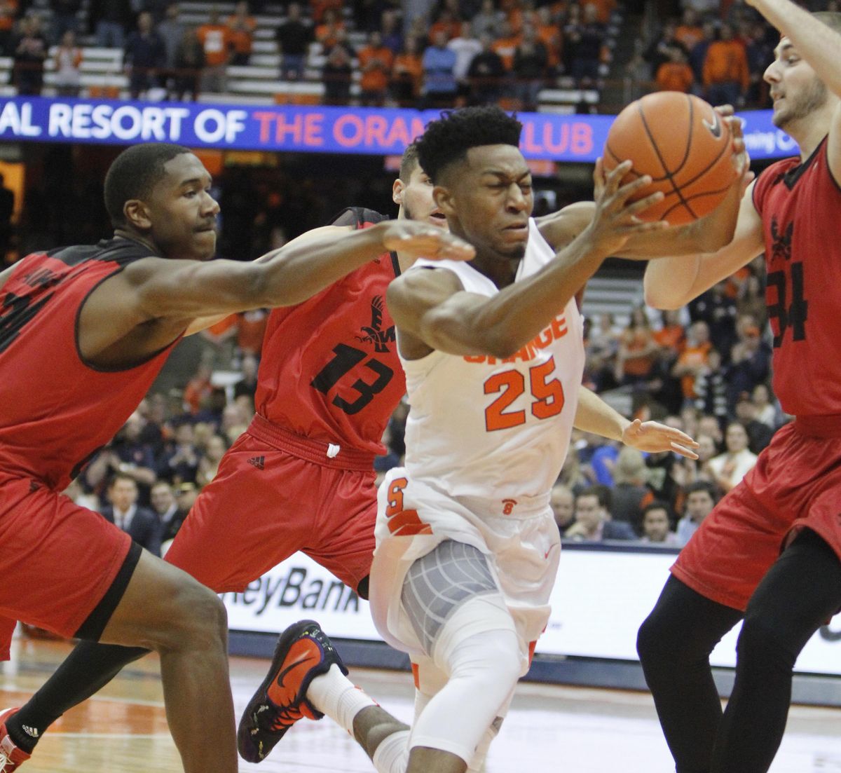 Syracuse’s Tyus Battle, center, drives to the hoop past Eastern Washington’s Kim Aiken, left, Luka Vulikic, back, and Jesse Hunt, right, in the first half  Tuesday in Syracuse, N.Y. (Nick Lisi / AP)
