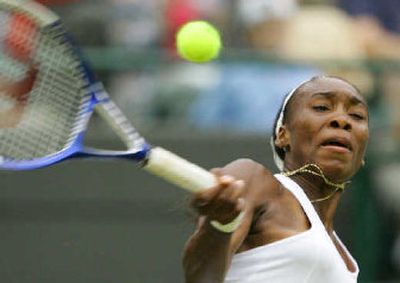
American Venus Williams returns the ball to Daniela Hantuchova during her win. 
 (Associated Press / The Spokesman-Review)