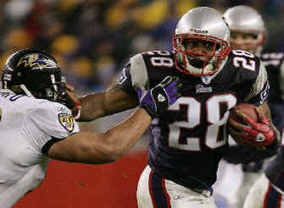 Corey Dillon is on pace to set a new single-season team rushing record in his first season in New England.
(Associated Press / The Spokesman-Review)