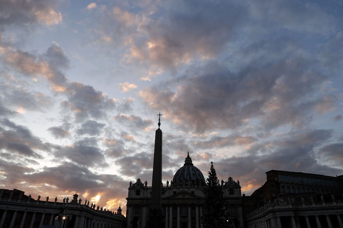 FILE - The sun sets behind St. Peter