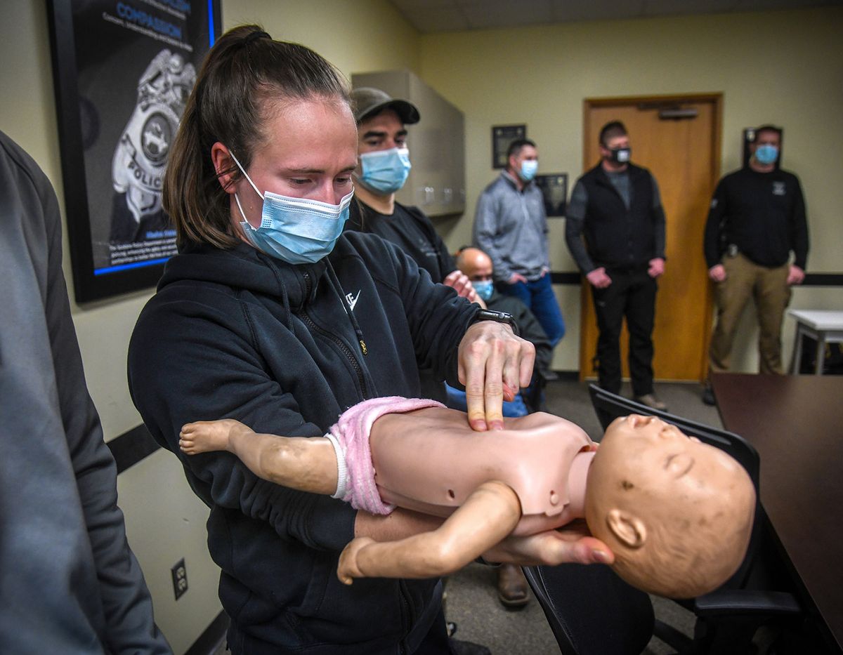 Spokane Police Officer Mikayla Holmes practices CPR on Baby Anne during demonstrations at spring in-service training, Friday, April 2, 2021, at the Spokane Police Academy.  (DAN PELLE/THE SPOKESMAN-REVIEW)