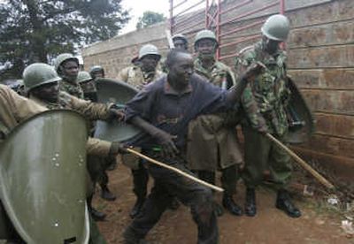 
Police detain an opposition supporter Monday during riots at the Kibera slum in Nairobi. Associated Press
 (Associated Press / The Spokesman-Review)