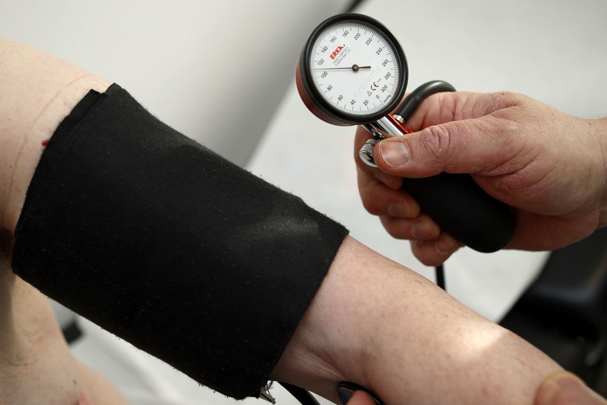 FILE - In this Feb. 6, 2009 file photo, a general practitioner measures the blood pressure of  a man at a surgery in Stuttgart, Germany. Nearly everywhere around the world, people are living longer and fewer children are dying. But more and more the world is grappling with the diseases and disabilities of modern life, according to the most expansive global look so far at life expectancy and the biggest health threats nation by nation. (Thomas Kienzle / Associated Press)