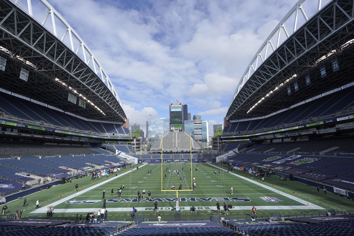 CenturyLink Field is shown as the Seattle Seahawks and the Dallas Cowboys warm up before an NFL football game, Sunday, Sept. 27, 2020, in Seattle.  (Elaine Thompson)
