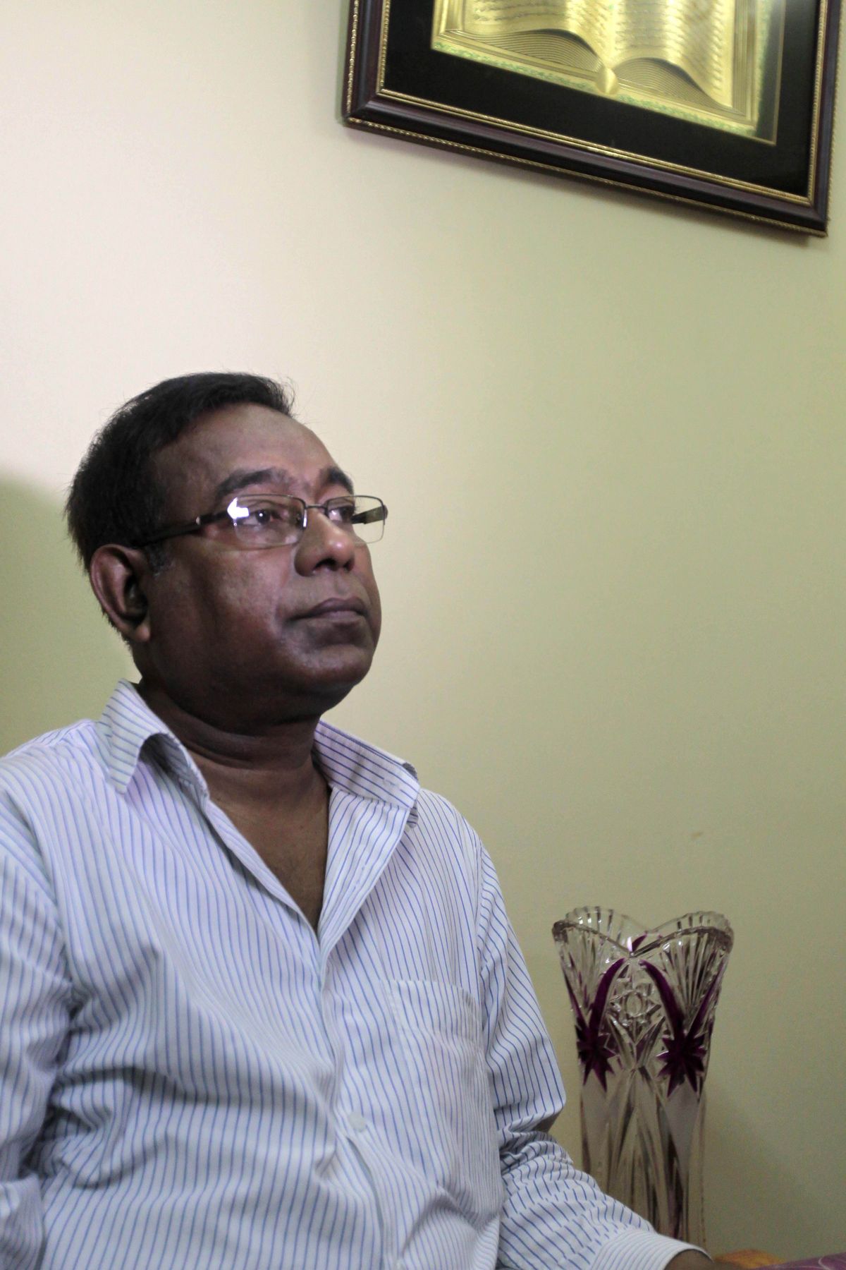 Bangladeshi Quazi Ahsanullah, father of Quazi Mohammad Rezwanul Ahsan Nafis, sits in his home in the Jatrabari neighborhood in north Dhaka, Bangladesh, Thursday, Oct. 18, 2012. The FBI arrested 21-year-old Nafis on Wednesday after he tried to detonate a fake 1,000-pound (454-kilogram) car bomb, according to a criminal complaint. His family said Thursday that Nafis was incapable of such actions. (A.m.ahad A.m.ahad / Associated Press)