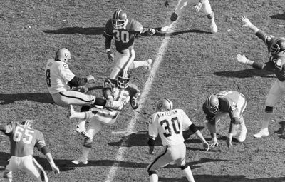 Associated Press Raiders punter Ray Guy (8) is hit by Denver’s John Schultz during the AFC championship game Jan. 1, 1978. (File Associated Press / The Spokesman-Review)