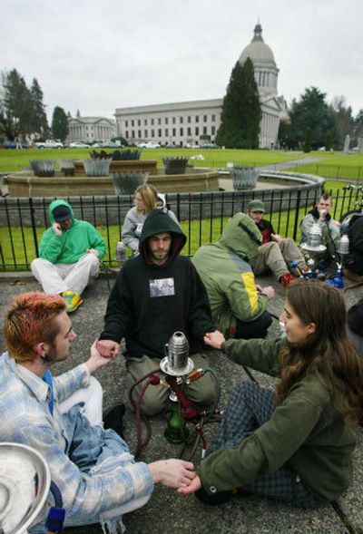 
While Idaho flunked the report, Washington state received a B. Not that all Washingtonians support the state's anti-smoking efforts. Matt Gibeau, left, Majik Allison, center; and Rebecca Wilmoth meditate  as they protest the state's smoking ban in all public places.
 (Associated Press / The Spokesman-Review)