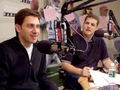 Mike Golic (right) waits for his turn at the microphone as Mike Greenberg fills the airwaves.
(Rich Arden/ESPN / The Spokesman-Review)