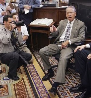 In this Sept. 26, 2007, file photo Sen. Charles Grassley, R-Iowa, talks to reporters in his Capitol Hill office in Washington. U.S. banks that are collecting billions of dollars in taxpayer loans to stay afloat sought government permission to import thousands of foreign workers for high-paying jobs in the United States, an Associated Press investigation has found. The job losses anger lawmakers like Sen. Charles Grassley, who is pushing legislation to make employers recruit American workers first, along with other reforms to the visa program. (AP Photo/Lawrence Jackson, File) (The Spokesman-Review)