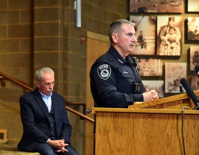 Coeur d’Alene Police Chief Lee White, right, takes questions about Saturday’s conspiracy to riot arrests during a news conference in the Coeur d’Alene Library on Monday.  (Jesse Tinsley/The Spokesman-Review)