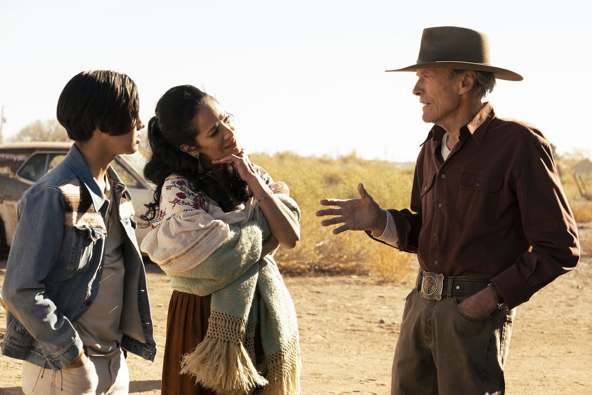 Eduardo Minett, Natalia Traven and Clint Eastwood in “Cry Macho.”  (Claire Folger/Warner Bros. Pictures)