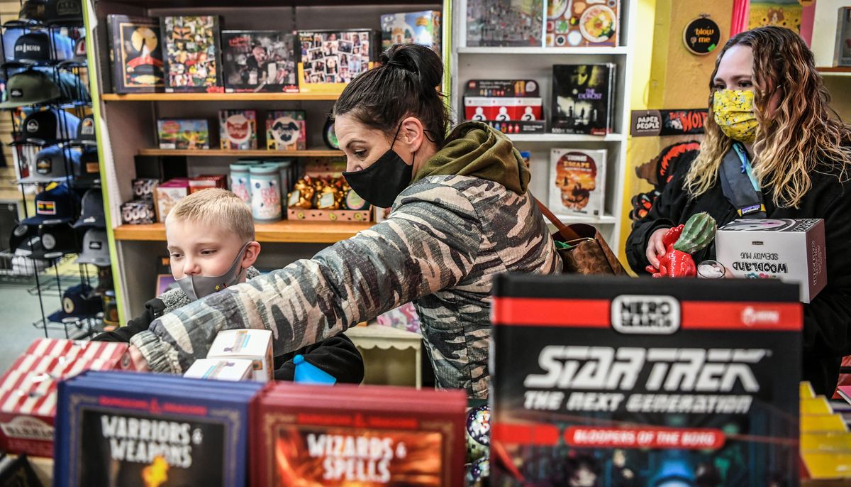 Breeze Stuhlmiller, Jenn Profant and Breana Hicks shop for last-minute Christmas gifts at Boo Radley’s on Friday in downtown Spokane. Profant said she was looking for stocking stuffers.  (DAN PELLE/THE SPOKESMAN-REVIEW)
