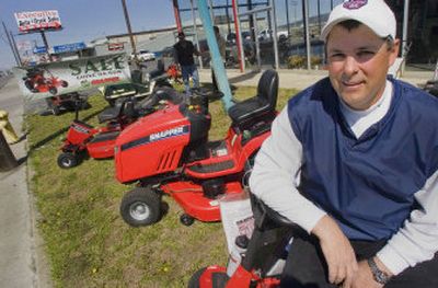 
Keith Mack sits on one of the mowers for sale at Spokane Valley Power Tool. Mack reopened the business after it closed in 2003  upon the death of his father-in-law. 
 (CHRISTOPHER ANDERSON / The Spokesman-Review)