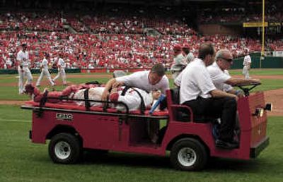 
Yadier Molina is taken off the field on a cart after Sunday's collision at home plate.  Associated Press
 (Associated Press / The Spokesman-Review)