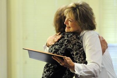 Cheryl Swedo, right, hugs Beverly Rule of the Hillyard Rotary Club Wednesday, after Rule presented  her with the Paul Harris Award, a high honor in the Rotary Club, for her  work with young people  as hospitality specialist at the Spokane Skills Center.  (Jesse Tinsley / The Spokesman-Review)
