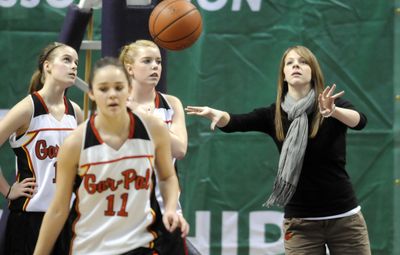 After Garfield-Palouse High school basketball player Emily Boone, right, was diagnosed with a heart defect, she became an assistant coach for the team.  (Colin Mulvany / The Spokesman-Review)