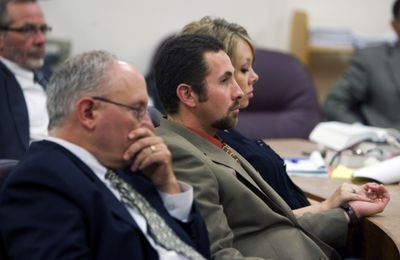 Carl Brent Worthington and Raylene Worthington and their attorneys, John Neidig, left rear, and Mark Cogan, left front, listen as the prosecution gives its closing argument against them Tuesday in Clackamas County Court in Oregon City, Ore. The Worthingtons’ daughter, Ava, was 15 months old when she died. (Associated Press / The Spokesman-Review)